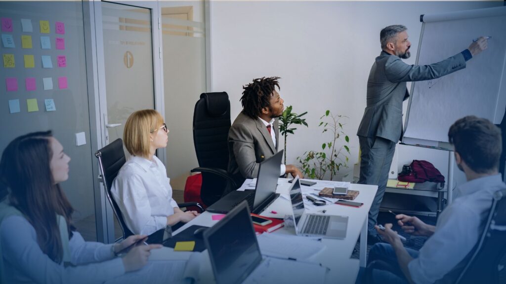 A collaborative team at a managed service provider lead generation company planning an MSP strategy.