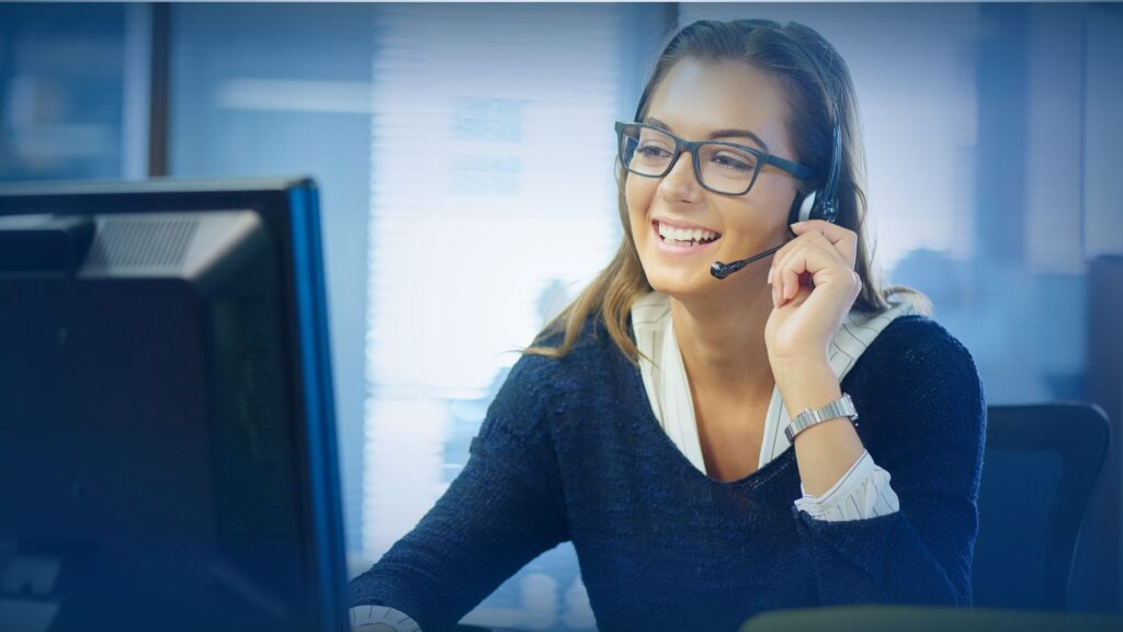 A professional team of B2B sales development representatives working in a modern office environment, representing an MSP telemarketing agency booking meetings.